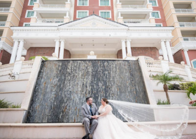 Bride and groom outside waterfall