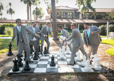 Groomsmen with big chess pieces