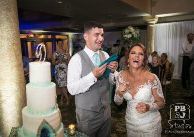 Bride and groom with wedding cake