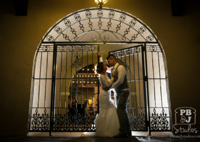 Bride and groom at gate