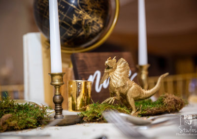 Gold dinosaur on table