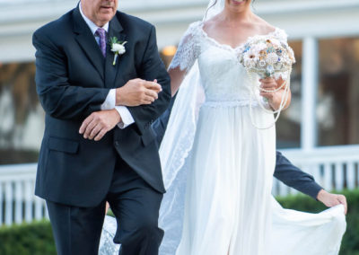 Jocelyn walking down the aisle with her father