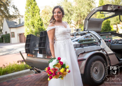 Renette posing next to Delorean