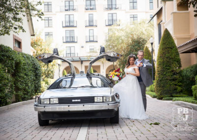 Renette and Todd checking the time entering Delorean