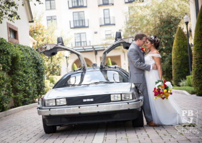 Renette and Todd next to Delorean