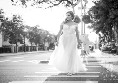 Renette crossing street in wedding dress