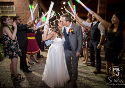 Renette and Todd kissing leaving wedding