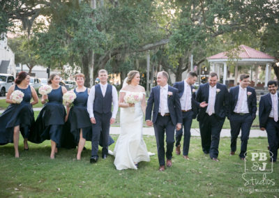 Kate and Steven walking with wedding party