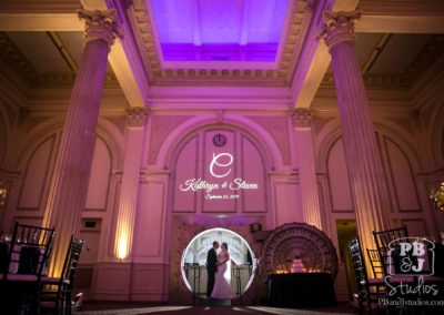 Kate and Steven outside open bank vault