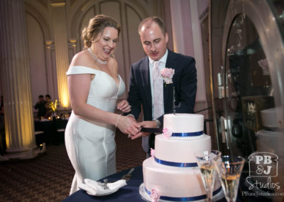 Kate and Steven cutting wedding cake